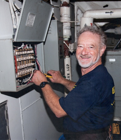 Bill wiring a building.